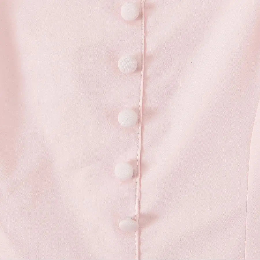 Różowa rozkloszowana sukienka z kokardami