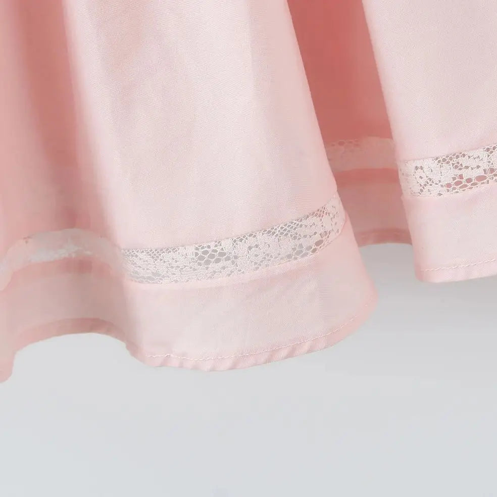 Różowa rozkloszowana sukienka z kokardami